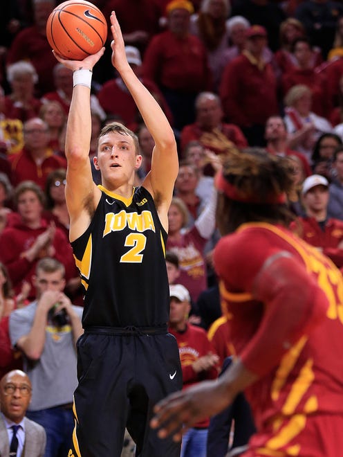 Iowa Hawkeyes forward Jack Nunge (2) puts up a shot as the Hawkeyes take on the Cyclones in Ames Thursday, Dec. 7, 2017.