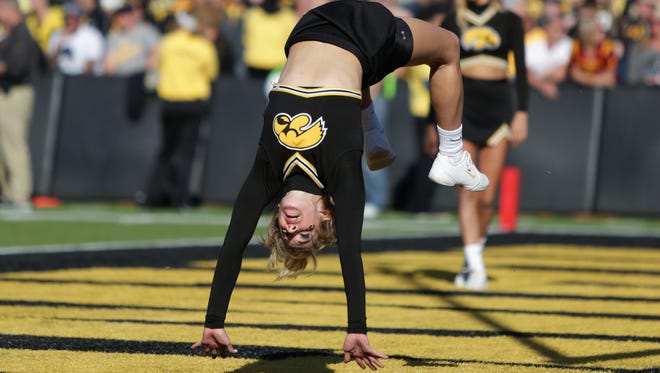 A University of Iowa cheerleader performs during a timeout against Iowa State on Saturday, Sept. 13, 2014, at Kinnick Stadium in Iowa City, Iowa.