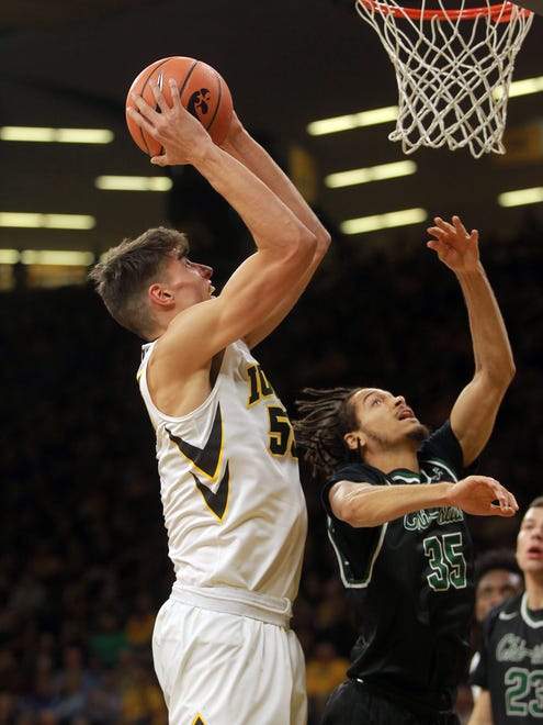 Iowa's Luka Garza goes up for a shot during the Hawkeyes' game against Chicago State at Carver-Hawkeye Arena on Friday, Nov. 10, 2017.