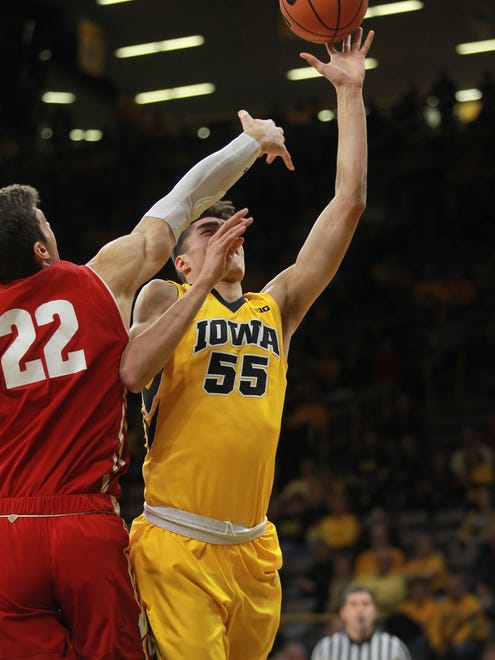Iowa's Luka Garza takes a contested shot during the Hawkeyes' game against Wisconsin at Carver-Hawkeye Arena on Tuesday, Jan. 23, 2018.