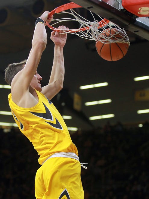 Iowa's Jack Nunge dunks off a stolen ball during the Hawkeyes' game against Michigan State at Carver-Hawkeye Arena on Tuesday, Feb. 6, 2018.