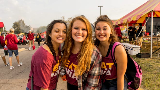 Sarah Gill, 21, Jade Bunn, 21, and Hannah Schmidt, 21, all of Ames, showing their cyclone pride at the 2017 Iowa Vs. Iowa State Game.