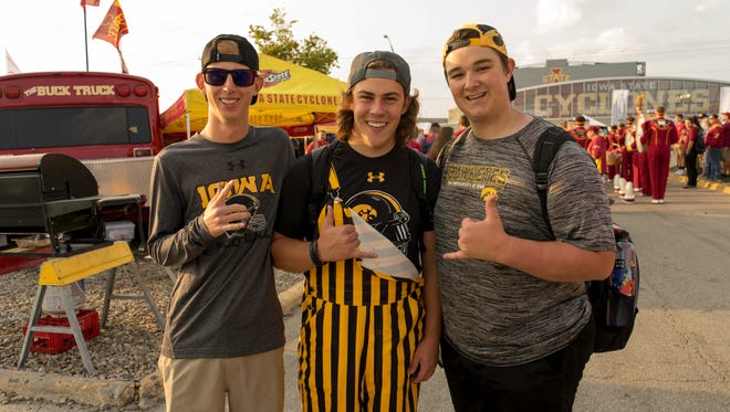 Dalton Huseman, 19, of Boone, Jacob Smiley, 19, of Boone, and Drew Smith, of Huxley, showing their support for the hawkeyes at the 2017 Iowa Vs. Iowa State Game.