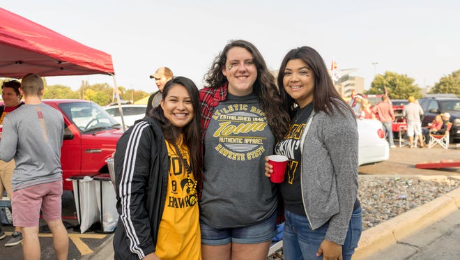 Melissa Vergara, 22, Danielle Nelson, 22, and Elsa Gonzales, 21, all of Muscatine, tailgating it up at the 2017 Iowa Vs. Iowa State Game.