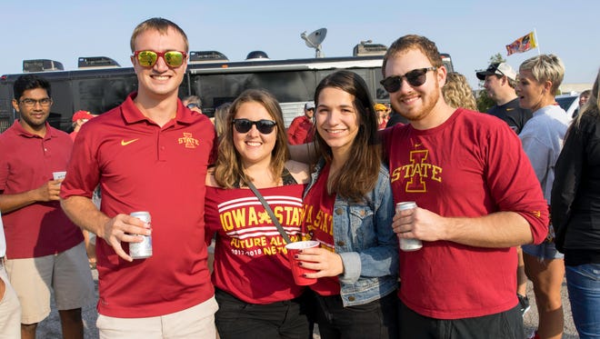 Jonathan Chicken, 22, of Waukee, Madison Vanderberg, 21, of Ames, Avery Pirano, 21, of Minneapolis, and Nate Stewart, 23, of Ames, showing their support for the cyclones at the 2017 Iowa Vs. Iowa State Game.