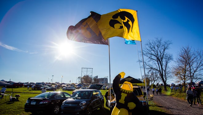 Hawkeyes flags and an inflatable Herky the Hawk on display before Iowa game vs. Penn State on Nov. 5 in State College, Penn.