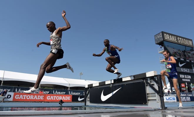 Hillary Bor, left, defeats Stanley Kebenei, center, and Andy Bayer, right, to win the 3,000 steeplechase during the USATF Championships at Drake Stadium in Des Moines, Iowa, on Jul 27, 2019. (Kirby Lee / USA Today Sports)