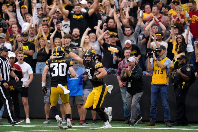 Iowa defensive back Cooper DeJean (3) celebrates with teammate defensive back Quinn Schulte (30) after intercepting a pass during the first half of an NCAA college football game against Iowa State, Saturday, Sept. 10, 2022, in Iowa City, Iowa. (AP Photo/Charlie Neibergall)