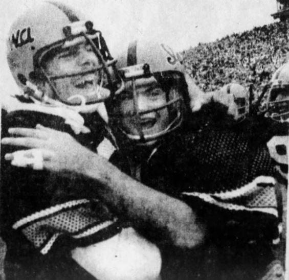 Iowa teammates Dan Schultz, left, and Tim Gutshall celebrate the Hawkeyes' 12-10 win in the 1977 Cy-Hawk game.