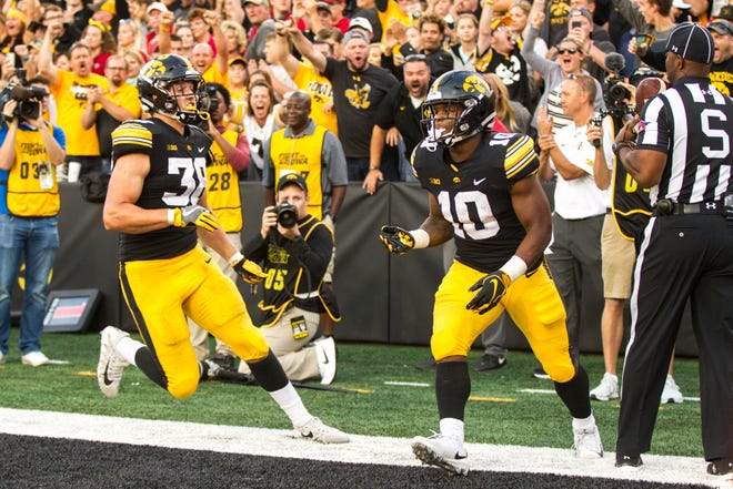 Iowa running back Mekhi Sargent (10) scores a touchdown during the Cy-Hawk NCAA football game on Saturday, Sept. 8, 2018, at Kinnick Stadium in Iowa City.