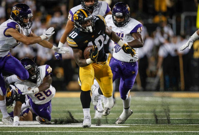 Iowa running back Mekhi Sargent blows through a hole in the Northern Iowa defense en route to a first down on Saturday, Sept. 15, 2018, at Kinnick Stadium in Iowa City.