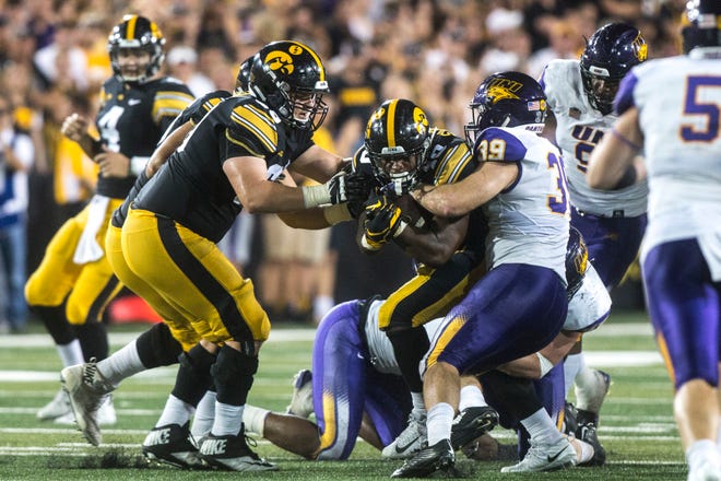 Iowa running back Mekhi Sargent (10) gets tackled by Northern Iowa linebacker Duncan Ferch (39) during an NCAA football game on Saturday, Sept. 15, 2018, at Kinnick Stadium in Iowa City.