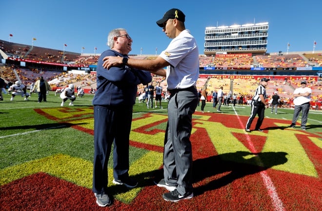 Akron head coach Terry Bowden, left, talks with Iowa State head coach Matt Campbell before a 2018 NCAA college football game in Ames.