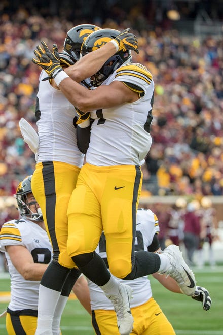 Oct 6, 2018; Minneapolis, MN, USA; Iowa Hawkeyes tight end T.J. Hockenson (left) celebrates with tight end Noah Fant (right) after scoring a touchdown against the Minnesota Golden Gophers in the first quarter at TCF Bank Stadium. Mandatory Credit: Jesse Johnson-USA TODAY Sports