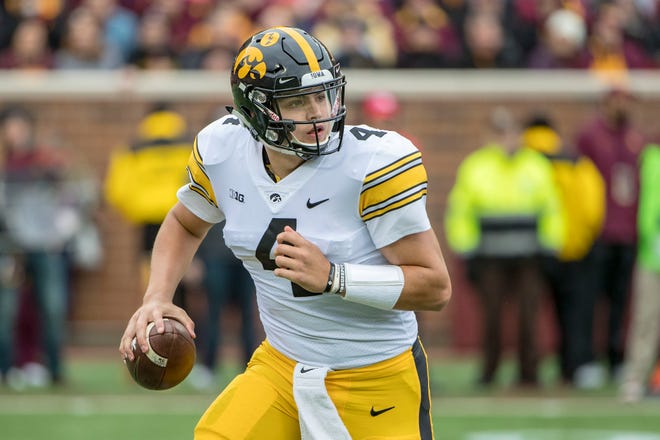 Oct 6, 2018; Minneapolis, MN, USA; Iowa Hawkeyes quarterback Nate Stanley (4) drops back for a pass in the first half against the Minnesota Golden Gophers at TCF Bank Stadium. Mandatory Credit: Jesse Johnson-USA TODAY Sports