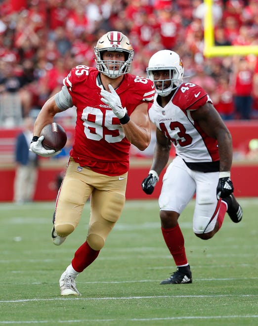 San Francisco 49ers tight end George Kittle (85) runs in front of Arizona Cardinals linebacker Haason Reddick (43) during the second half of an NFL football game in Santa Clara, Calif., Sunday, Oct. 7, 2018.