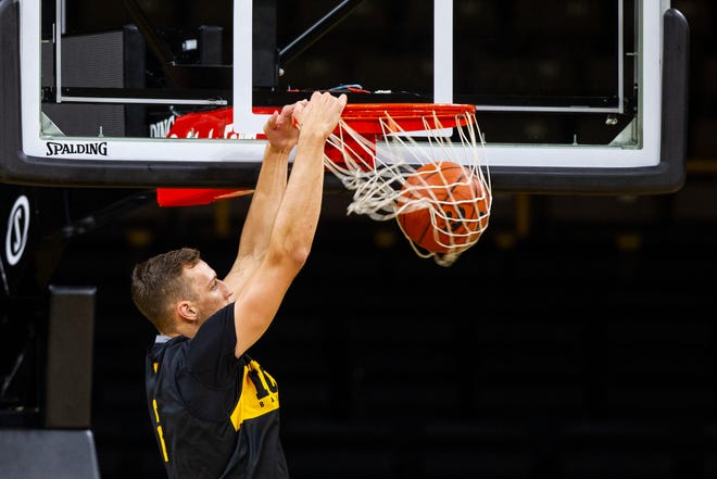 Iowa forward Jack Nunge (2) dunks during men's basketball practice following media day on Monday, Oct. 8, 2018, at Carver-Hawkeye Arena in Iowa City.