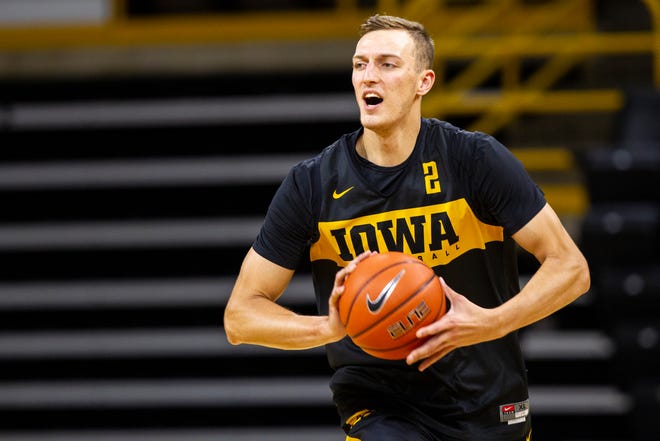 Iowa forward Jack Nunge (2) runs a drill during men's basketball practice following media day on Monday, Oct. 8, 2018, at Carver-Hawkeye Arena in Iowa City.