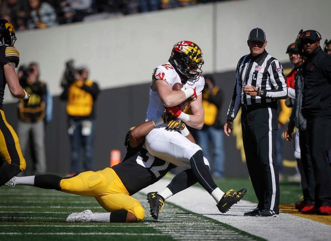 Iowa linebacker Djimon Colbert forces Maryland's Avery Edwards out of bounds on Saturday, Oct. 20, 2018, at Kinnick Stadium in Iowa City.