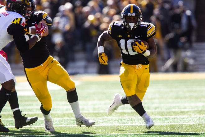 Iowa running back Mekhi Sargent (10) rushes during an NCAA Big Ten conference football game on Saturday, Oct. 20, 2018, at Kinnick Stadium in Iowa City.