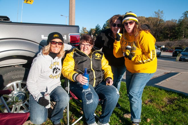 Colleen Kafar, (left), Lisa Bauer, Becky Bergfeld, and Lisa Lenz, of Dubuque, Saturday, Oct. 20, 2018, while tailgating before the Iowa game against Maryland in Iowa City.