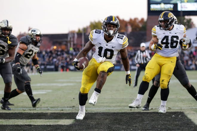 Iowa running back Mekhi Sargent (10) scores a touchdown against Purdue in the second half of an NCAA college football game in West Lafayette, Ind., Saturday, Nov. 3, 2018.
