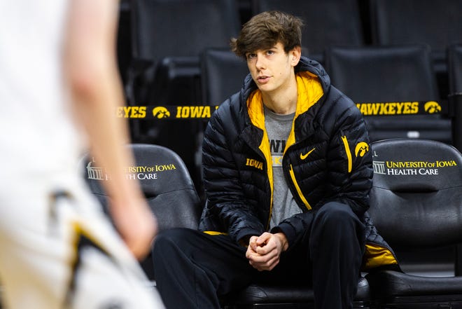 Iowa City West senior Patrick McCaffery sits on the bench during warmups before an NCAA men's basketball game on Wednesday, Nov. 21, 2018, at Carver-Hawkeye Arena in Iowa City.