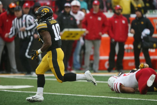 Iowa's Mekhi Sargent runs with the ball during the senior day match-up between the Iowa Hawkeyes and the Nebraska Cornhuskers on Friday, Nov. 23, 2018, at Kinnick Stadium, in Iowa City.