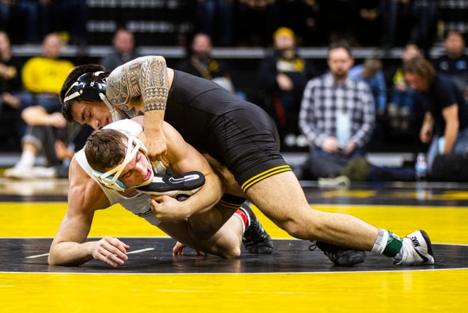 Iowa's Pat Lugo, right, wrestles Lehigh's Jimmy Hoffman at 149 during a NCAA wrestling dual on Saturday, Dec. 8, 2018, at Carver-Hawkeye Arena in Iowa City.