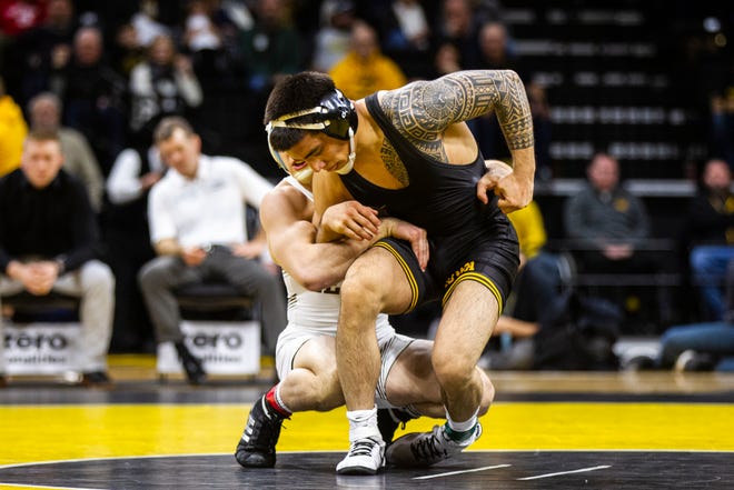 Iowa's Pat Lugo, right, gets an escape while wrestling Lehigh's Jimmy Hoffman at 149 during a NCAA wrestling dual on Saturday, Dec. 8, 2018, at Carver-Hawkeye Arena in Iowa City.