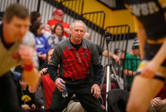 Nashua-Plainfield wrestling coach Al Frost watches as sophomore Toyia Griffin pinned Waverly-Shell Rock's Hedda Kveum in 16 seconds of the first period to win a state title at 152 pounds on Saturday, Jan. 19, 2019, during the first Iowa girls state wrestling tournament at Waverly-Shell Rock High School in Waverly.