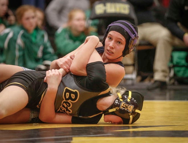 AGWSR junior Ali Gerbracht looks up at the clock while controlling Bettendorf's Ella Schmit in their match at 106 pounds on Saturday, Jan. 19, 2019, during the first Iowa girls state wrestling tournament at Waverly-Shell Rock High School in Waverly. Gerbracht won and went down in state history as the first Iowa high school girl state wrestling champion.