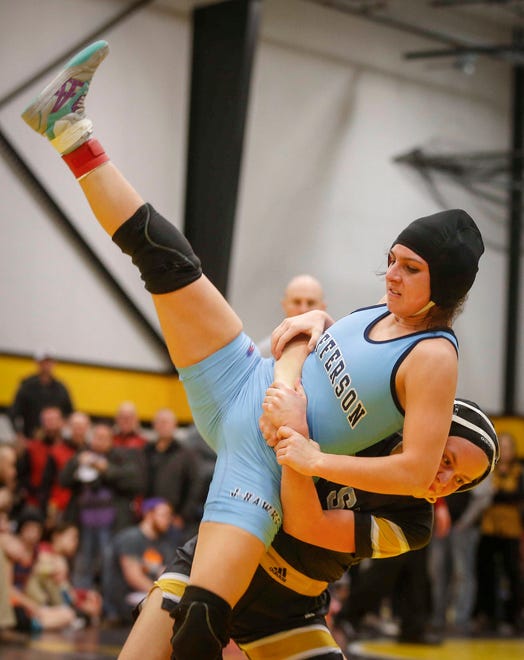 Cedar Rapids Jefferson junior Chloe Clemons is brought to the mat in her match against Waverly-Shell Rock's Jacey Meier in their state title match on Saturday, Jan. 19, 2019, during the first Iowa girls state wrestling tournament at Waverly-Shell Rock High School in Waverly.