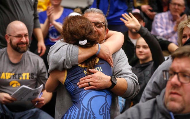 Davenport North junior Tateum Park gets a hug after her win over Waukon's Meridian Snitker for a 113-pound state championship on Saturday, Jan. 19, 2019, during the first Iowa girls state wrestling tournament at Waverly-Shell Rock High School in Waverly.