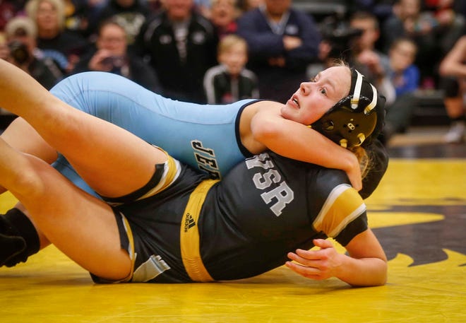 Cedar Rapids Jefferson junior Chloe Clemons pulls Waverly-Shell Rock's Jacey Meier down to her back in their state title match on Saturday, Jan. 19, 2019, during the first Iowa girls state wrestling tournament at Waverly-Shell Rock High School in Waverly.