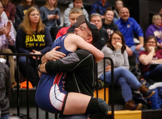 Davenport Central freshman Sydney Park gets a hug after she beat Waukon's Regan Griffith for a state title at 126 pounds on Saturday, Jan. 19, 2019, during the first Iowa girls state wrestling tournament at Waverly-Shell Rock High School in Waverly.