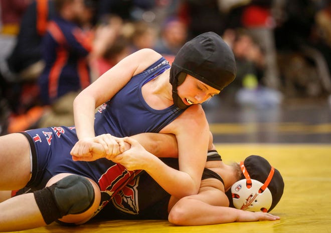 Davenport Central freshman Sydney Park controls Waukon's Regan Griffith in their match at 126 pounds on Saturday, Jan. 19, 2019, during the first Iowa girls state wrestling tournament at Waverly-Shell Rock High School in Waverly.