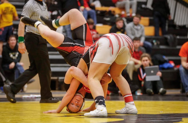 LeMars junior Jacenta Sargisson tosses Waukon's Nevaeh Bushaw to the mat en route to a state title win at 170 pounds on Saturday, Jan. 19, 2019, during the first Iowa girls state wrestling tournament at Waverly-Shell Rock High School in Waverly.