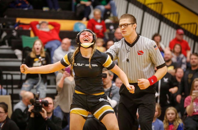 Waverly-Shell Rock freshman Annika Behrends celebrates after winning a state title at 132 pounds over Logan-Magnolia's Olivia Diggins on Saturday, Jan. 19, 2019, during the first Iowa girls state wrestling tournament at Waverly-Shell Rock High School in Waverly.
