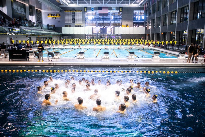 Iowa Hawkeyes celebrate in the diving pool after a NCAA Big Ten Conference swimming meet on Saturday, Jan. 19, 2019, at the Campus Recreation and Wellness Center in Iowa City, Iowa.