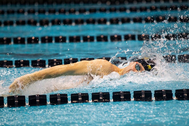 Iowa senior Jack Smith finishes the final stretch of the 400 yard freestyle relay during a NCAA Big Ten Conference swimming meet on Saturday, Jan. 19, 2019, at the Campus Recreation and Wellness Center in Iowa City, Iowa. Smith brought in the win with a final time of 2:57.41.