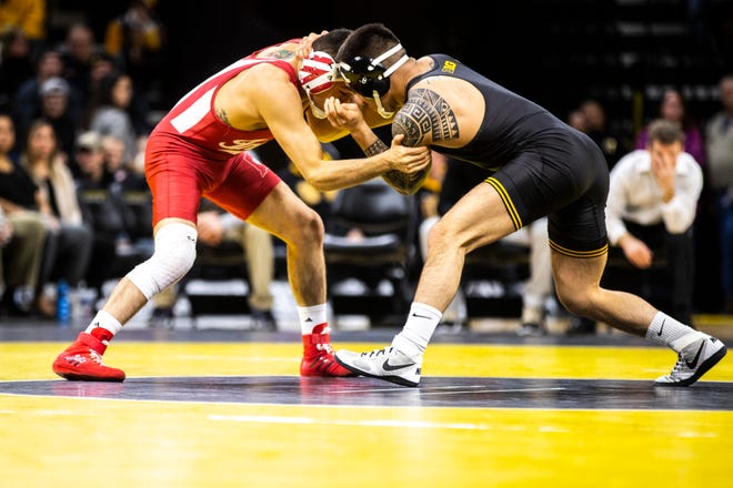 Iowa's Pat Lugo, right, wrestles Indiana's Fernie Luigs at 149 during a NCAA Big Ten Conference wrestling dual on Friday, Feb. 15, 2019 at Carver-Hawkeye Arena in Iowa City, Iowa.