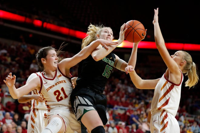 Baylor forward Lauren Cox, center, grabs a rebound between Iowa State's Bridget Carleton, left, and Madison Wise, right, during the first half of an NCAA college basketball game, Saturday, Feb. 23, 2019, in Ames, Iowa.