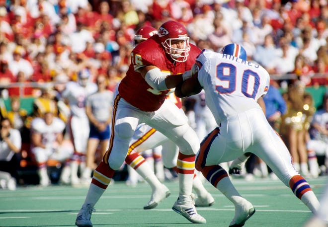 Kansas City Chiefs tackle John Alt (76) blocks Denver Broncos defensive end Ron Holmes (90) at Arrowhead Stadium in 1989. Alt, a former Iowa Hawkeye, was taken with the 21st pick of the first round in the 1984 NFL Draft.