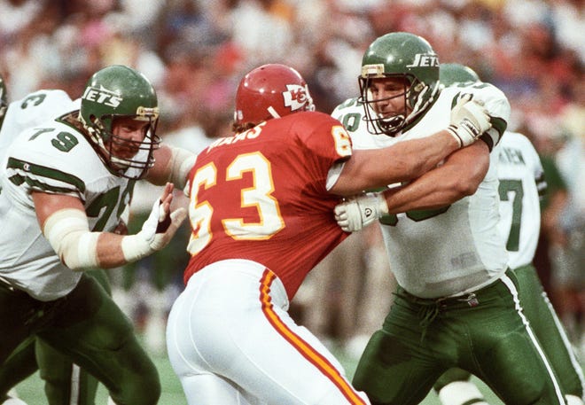 New York Jets offensive linemen Mike Haight, left, and Jeff Criswell in action against Kanas City Chiefs defensive end Bill Maas (63) at Busch Stadium during the 1991 preseason. Haight, a former Hawkeye, was selected with the 22nd pick in the 1986 NFL Draft by the Jets.