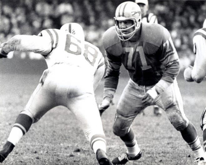 Detroit Lions defensive tackle Alex Karras (71) in action against the Baltimore Colts at Tigers Stadium in 1964. Karras, a former Iowa Hawkeye, was taken 10th overall by the Detroit Lions in the 1958 NFL Draft.