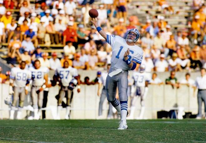 Detroit Lions quarterback Chuck Long (16) throws a pass against the Tampa Bay Buccaneers at Tampa Stadium during the 1986 season. Long, a former Iowa Hawkeye, was the 12th ovearll pick by the Detroit Lions in the 1986 NFL Draft.