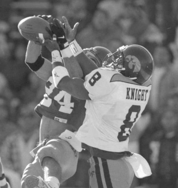 Iowa defensive back Tom Knight defends a pass to  Washinton's Jerome Pathon in the 1995 Sun Bowl. Knight was the ninth overall pick by the Arizona Cardinals in the 1997 NFL Draft.