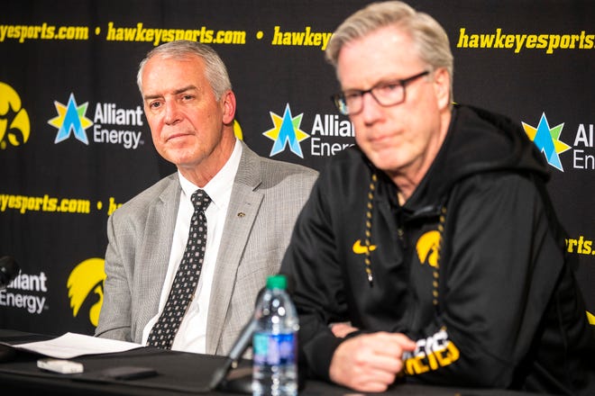 Iowa athletic director Gary Barta, left, and Fran McCaffery listen to a question during a press conference on Wednesday, Feb. 27, 2019, at Carver-Hawkeye Arena in Iowa City, Iowa.