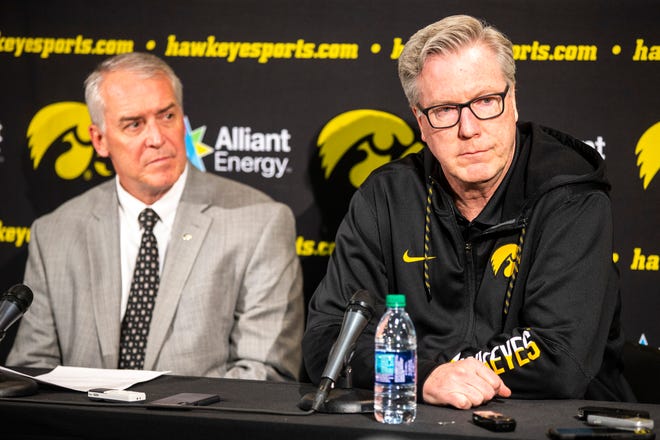 Iowa athletic director Gary Barta, left, and Iowa men's basketball head coach Fran McCaffery listen to a question during a press conference on Wednesday, Feb. 27, 2019, at Carver-Hawkeye Arena in Iowa City, Iowa.